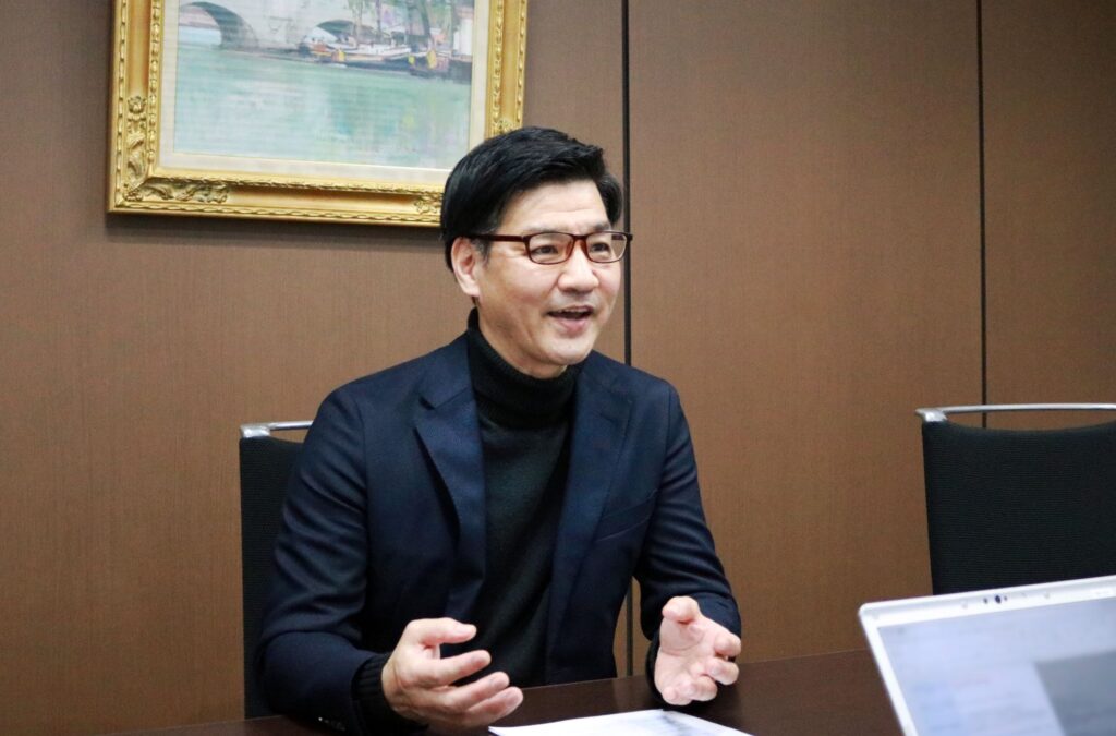大和ハウス・アセットマネジメントの支援事例インタビューにおける、加藤氏のTCFDの笑顔のカット